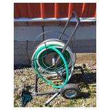 Hose on reel and sprinkler