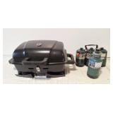 Portable BBQ and 4 cans of propane