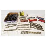 Assorted train track, train cars, and 1 power