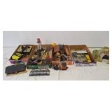Assorted train building pieces, cars, and parts
