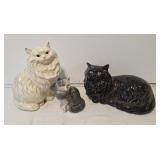 Trio of cat figurines