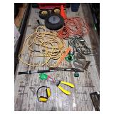 Various extension cords, wheel barrow wheel,
