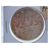 About Uncirculated 1957 Canada One Dollar Coin