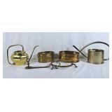 2 brass watering cans, 2 oval brass planters, one