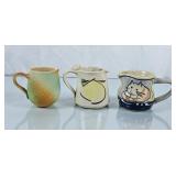 Trio of Handpainted Pottery Creamers