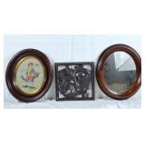Oval mirror, oval needlepoint picture, and wall