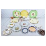 Assorted decorative plates, cups, and saucers