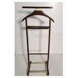 Valet stand featuring a wooden frame and brass