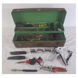 Metal toolbox with wrenches, caulking gun,