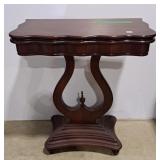 Mahogany flip-top game table features a
