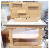 Work Bench table on wheels with roll of paper on