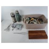 Assortment of kitchen utensils, scale, thermoses,