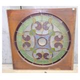 Vintage round leaded stained glass window with