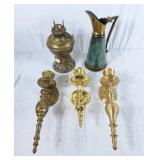 Trio of brass wall sconces, brass oil lamp, and