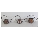 Trio of vintage copper watering cans