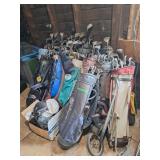 Large assortment of golf clubs with bags