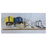 Two vintage football helmets with attachments and
