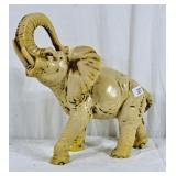 Vintage faux ivory elephant sculpture.