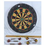 Dart board and two sets of darts.