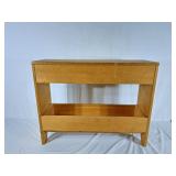 VIntage light-wood storage unit featuring an open