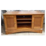 Medium-brown wood veneer or laminate TV stand and