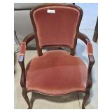 Lovely cabriolet armchair featuring a dark wood