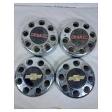 Two Chevrolet and Two GMC Hub Caps