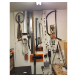 Items on Wall: Tennis Racket, Saw, Ruler, Level & More