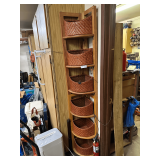Corner Shelf Unit Featuring Woven Baskets For Storage
