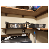 Contents of Cabinet Featuring Cookware