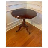 20th Century Mahogany Tea Table Featuring a Pedestal Base with Tripod Legs & Wheels