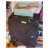 Black Suitcase Filled with Assorted Clothes and Ac