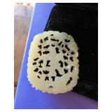 Carved Jade Pendant with Intricate Cutwork Design