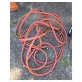 Coiled Red Rubber Utility Hose