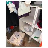 White Shelf Unit with Contents on and in Front
