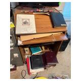 Wood Desk With Some Contents Including Books and D