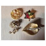 Four Vintage Gold-Tone Brooches with Various Desig