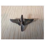 Metallic Pin Featuring Spread Wings and Propeller