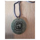 Green Stone Pendant With Engraved Design and Cord