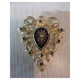 Gold-Tone Brooch with Black and White Floral Cente