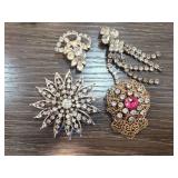 Four Rhinestone and Metal Brooches