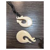Two Carved Bone Fish Hook Pendants with Cord Neckl