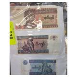 Three Myanmar Kyat Banknotes Featuring Various Den