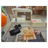 Singer Sewing Machine with Accessories and Manuals
