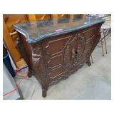 Wooden Cabinet With Carved Details and Black Marbl