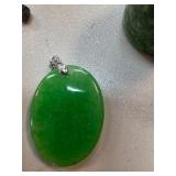 Oval-Shaped Jade Pendant With Diamond Accent