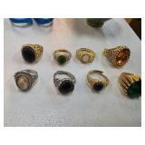 Eight Ornate Gold- and Silver-Colored Rings with G
