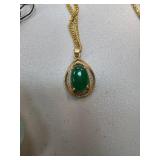 Gold Necklace with Jade Pendant and Intricate Deta
