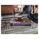 Items Including Shoes, Clock Radio, and Remote Con