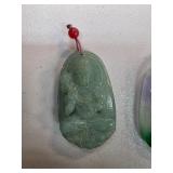 Jade Pendant Featuring a Seated Figure